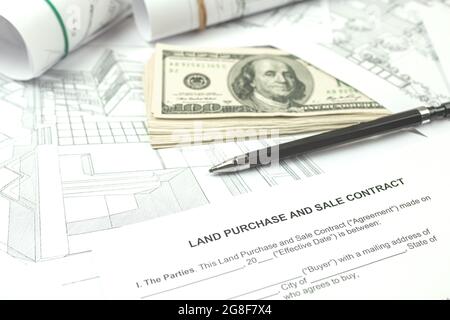 Construction of a building on a new plot of land according to architectural drawings, office desk background photo Stock Photo