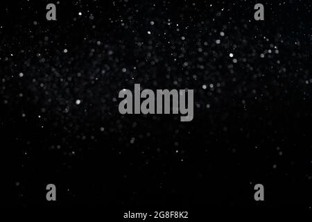 Small bokeh circles on black background for overlay blending mode. Stock Photo
