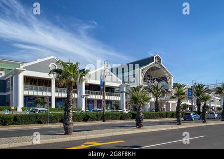 Cape Town, South Africa – November 4, 2019: Facade of Victoria Wharf Shopping Centre against blue sky Stock Photo