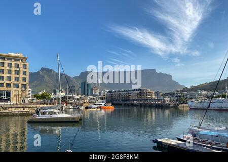 Cape Town, South Africa – November 4, 2019: Scenic view of Victoria and Alfred Waterfront (W&A Waterfront) against Table Mountain and blue sky Stock Photo