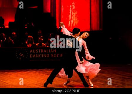 Australian Ballroom Dancers Samuel Brown and Berkley Wood dancing in Under 21 category Standard during the 73rd Australian Dancesport Championship. Stock Photo