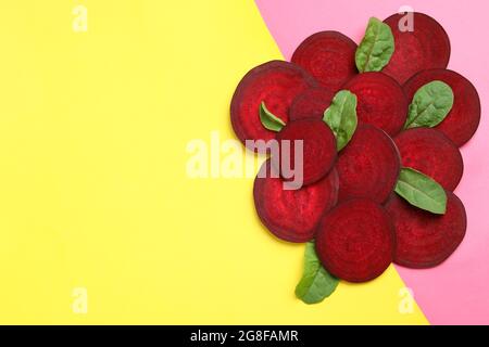Ripe red beet with leaves on two tone background Stock Photo