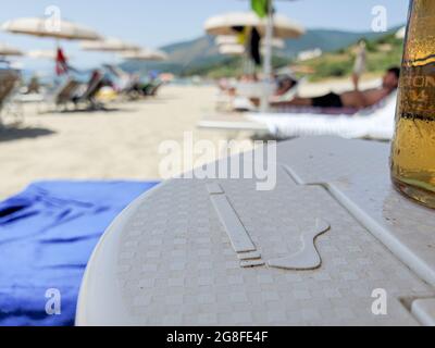 No smoking sign on beach umbrella in summer time,healthy sea lifestyle Stock Photo