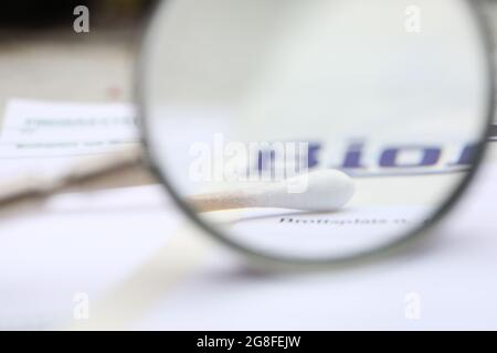 BioPack bag and a forensic cotton swab for securing blood and secretions, which is part of the police's forensic investigation at a crime scene. Stock Photo