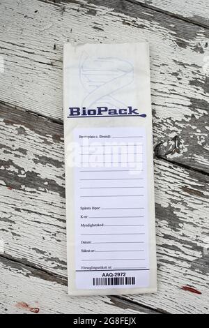 BioPack bag and a forensic cotton swab for securing blood and secretions, which is part of the police's forensic investigation at a crime scene. Stock Photo