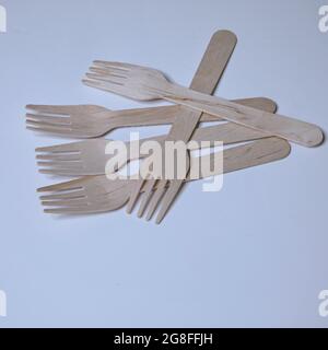 Wooden Forks. Isolated. Copy Space. Five small  wooden forks on a white background. Stock Image. Stock Photo