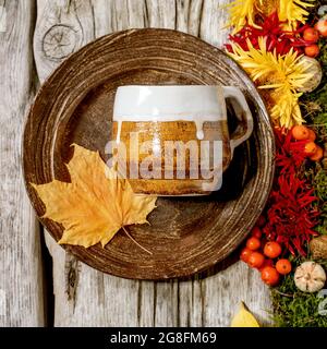 Autumn tablesetting with moss and leaves Stock Photo