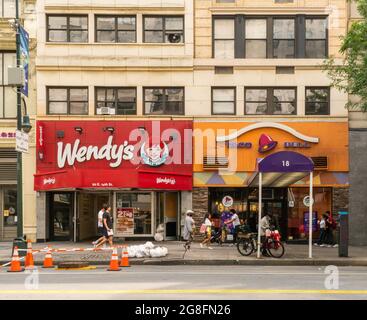 Wendy’s and Taco Bell fast food restaurants side by side in Union Square in New York on Sunday, July 11, 2021. (© Richard B. Levine) Stock Photo