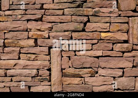 wall of natural red large stones. background. Copy space Stock Photo