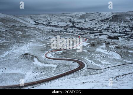 Car light trails on winding road in winter, Edale, Derbyshire, England, United Kingdom, Europe Stock Photo