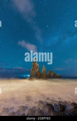 Waves crashing over Ilheus da Rib and Ribeira da Janela rock formations under the starry night sky, Madeira, Portugal, Atlantic, Europe Stock Photo