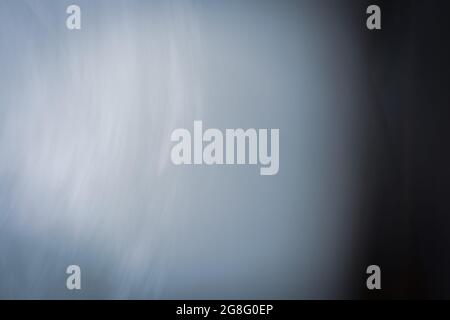 Abstract blurred dark blue background. Look at the light above from the depths of the sea. Photo effect. Stock Photo