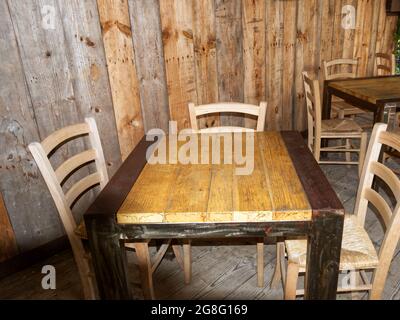 an industrial-style iron and wood table seen from above Stock Photo