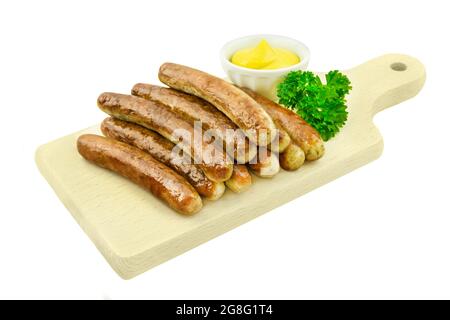 Ten Nuernberger sausages isolated against white background Stock Photo