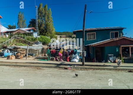 CURACO DE VELEZ, CHILE - MARCH 21, 2015: Poor houses of fishermen in Curaco de Velez village, Quinchao island, Chile Stock Photo