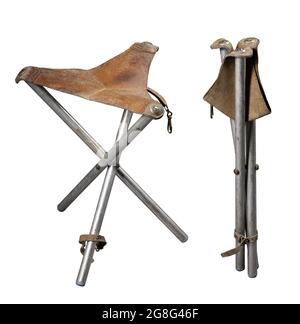 Folding fishing stool for sitting. Handy accessories for anglers and hunters. Isolated background. Stock Photo