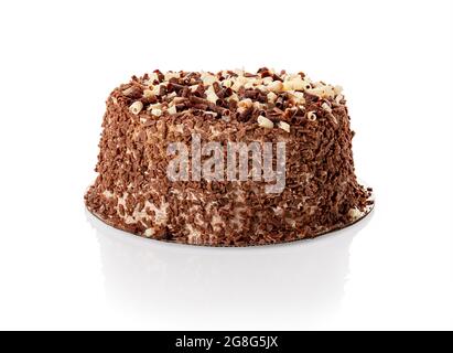 Cake with shavings of white and dark chocolate isolated on white. Water drops condensed on the cake when it was taken out of the fridge on a hot day. Stock Photo