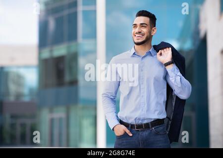 Happy muslim entrepreneur going home from job Stock Photo