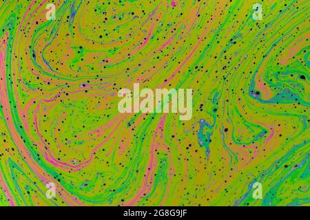 Fluid soap bubble psychedelic colorful abstract art. Surreal patterns with rainbows and waves of color in motion. Stock Photo