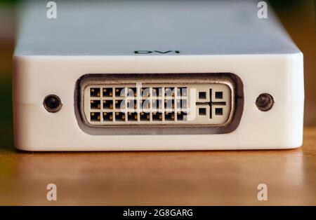 DVI port outlet, video card connector on white panel, selected focus. Stock Photo