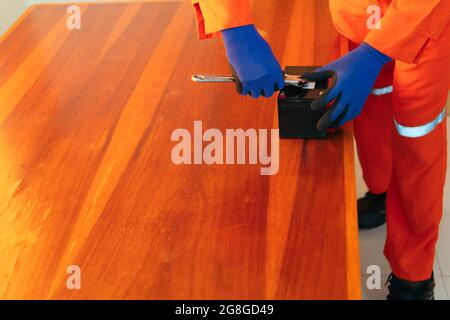 African mechanic working on a house Stock Photo