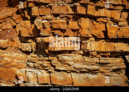 Surface, background, texture of a rock with a brownish-red tint Stock Photo