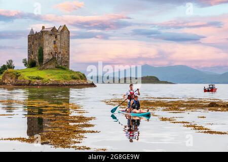 Castle Stalker, a sea castle built on a small rocky island in Loch Laich a small inlet off Loch Linnke near Port Appin, Argyll as viewed from Portnacr Stock Photo