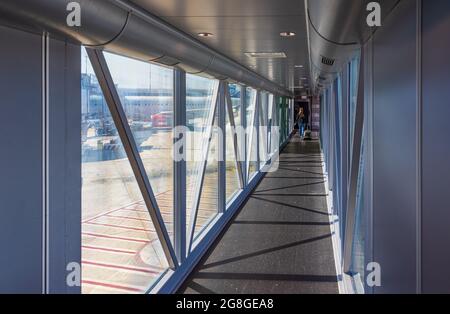 ROME, ITALY - JULY 19, 2021: Hallway of airport, aero bridge or Jet bridge leading to airplane Stock Photo
