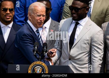 United States President Joe Biden shakes hands with Tampa Bay Buccaneers wide receiver Chris Godwin (14) prior to making remarks welcoming the 2021 the Super Bowl LV (Super Bowl 55) Champion Tampa Bay Buccaneers to the White House in Washington, DC on July 20, 2021. The event marked the first visit to the White House by the reigning Super Bowl champions in four years.Credit: Samuel Corum/CNP /MediaPunch Stock Photo