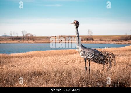 Gallocanta, Zaragoza, Spain; 2019, 8th February: Life-size metal statue of a crane looking at the lagoons where these birds live. Stock Photo