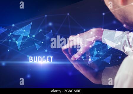 Businessman touching huge screen concept Stock Photo