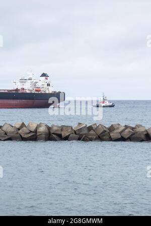 Large oil tanker and tug boat Stock Photo