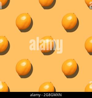 Orange seamless pattern. Fruit pattern for the design. Summer background. Minimal fruit concept. Top view, flat lay. Stock Photo