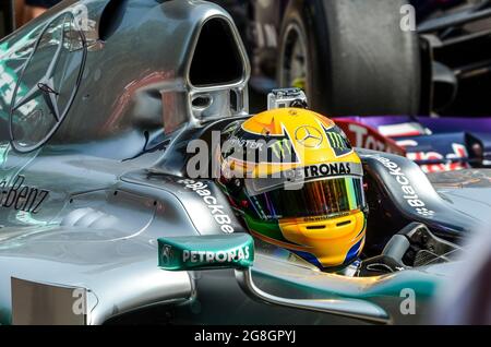 Lewis Hamilton (behind visor) in the cockpit of a Mercedes Formula