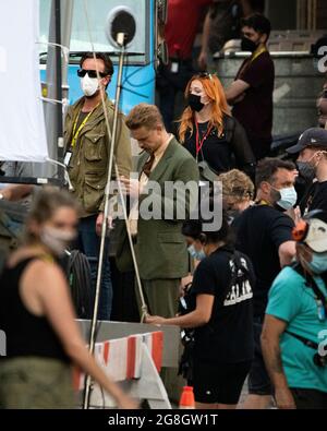 Glasgow, Scotland, UK. 20th July, 2021. PICTURED: Boyd Holbrook seen in between takes on set. Filming on the set of Indiana Jones 5 in the middle of Glasgow city centre as the Hollywood blockbuster sets up Glasgow as New York City. A full production can be seen, with a large cast, producers and extras. The city centre has been changed so that all the shop fronts and building look like 1959 America. Credit: Colin Fisher/Alamy Live News Stock Photo