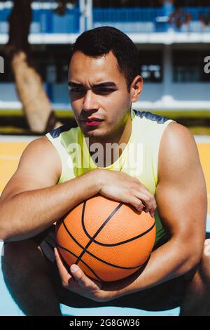 young latin man playing basketball portrait in Mexico Stock Photo