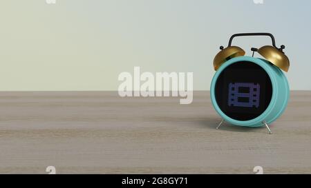 3d rendering of color alarm clock with symbol of film strip on dot display on wooden table with colored wall Stock Photo