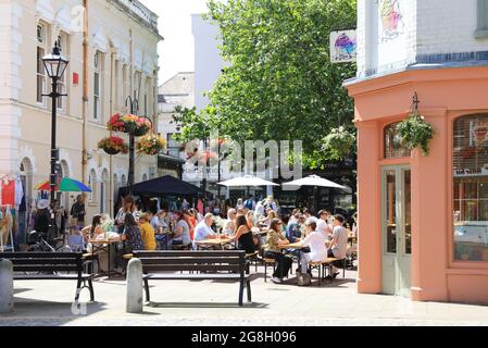 People relaxing at the Greedy Cow cafe on Market Place in the creative Old Town of seaside town Margate, in Thanet, east Kent, UK Stock Photo