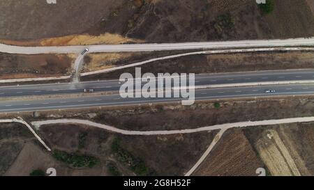 Road top down drone shot aerial truck passing Stock Photo