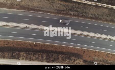 Road top down drone shot aerial truck passing Stock Photo