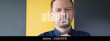 Young man folding his hands and pray Stock Photo
