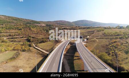 Tunnel double barelled road and clear sky Stock Photo