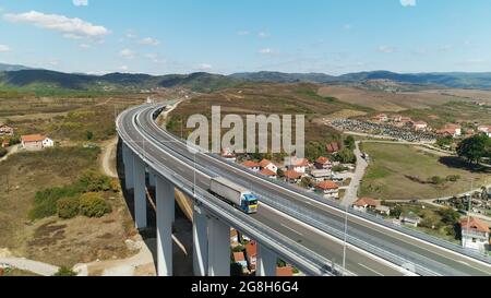 Viaduct traffic truck. Drone shot, sunny day, blue sky Stock Photo