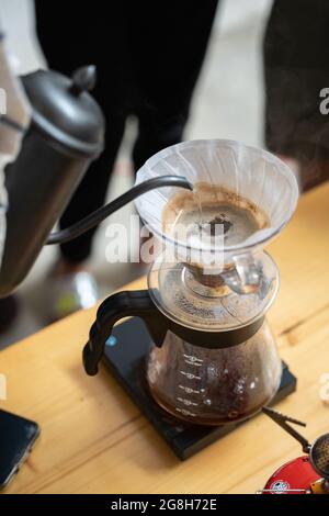 Making process of V60 coffee, filter coffee, pouring hot water on the coffee Stock Photo