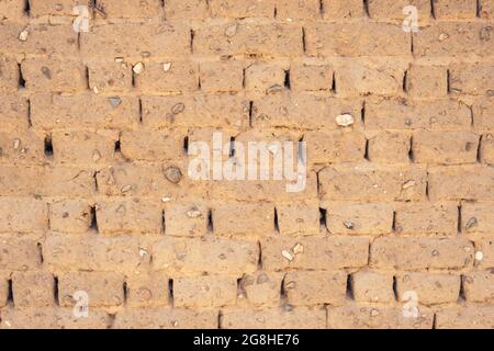 Closeup of building wall of adobe mud sun dried bricks showing texture during construction in Turkey Stock Photo