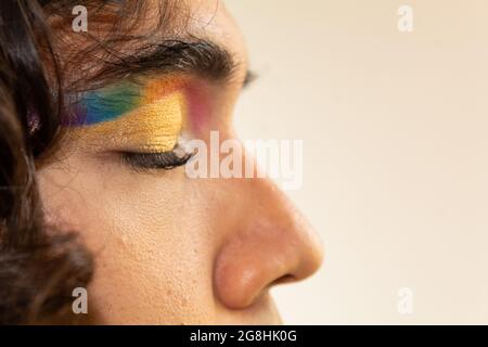 close up of eyes made up with a rainbow on a white background Stock Photo
