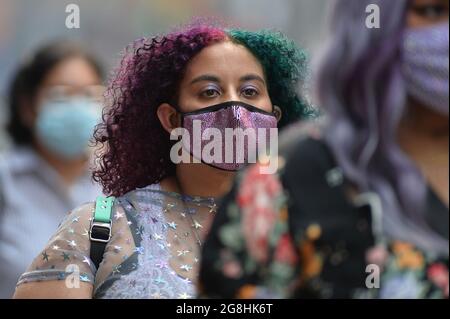 New York, USA. 20th July, 2021. People are seen in Times Square, some wearing masks and others not, as reports say that the Delta Variant of COVID-19 spreading across the United States accounts for 83 percent of new cases, New York, NY, July 20, 2021. (Photo by Anthony Behar/Sipa USA) Credit: Sipa USA/Alamy Live News Stock Photo