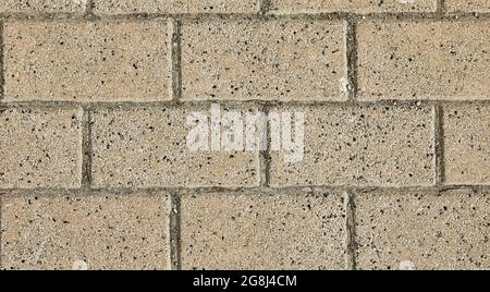 Background of the stone wall of the castle made of stones of different shapes and sizes and textures Stock Photo