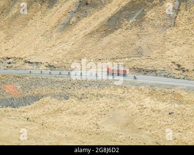 Mountain bikers riding the famous downhill trail Road of death in Bolivia. Stock Photo