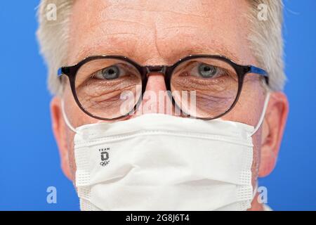 Tokio, Japan. 21st July, 2021. Olympia, kick-off press conference of Team Germany in the press centre of the International Plaza of the Olympic Village. Dirk Schimmelpfennig, Chef de Mission, speaks with mouth-nose protection. Credit: Michael Kappeler/dpa/Alamy Live News Stock Photo